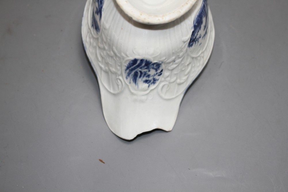 A Lowestoft blue and white sauceboat, c.1770 and two Worcester blue and white sauceboats, c.1758-65,